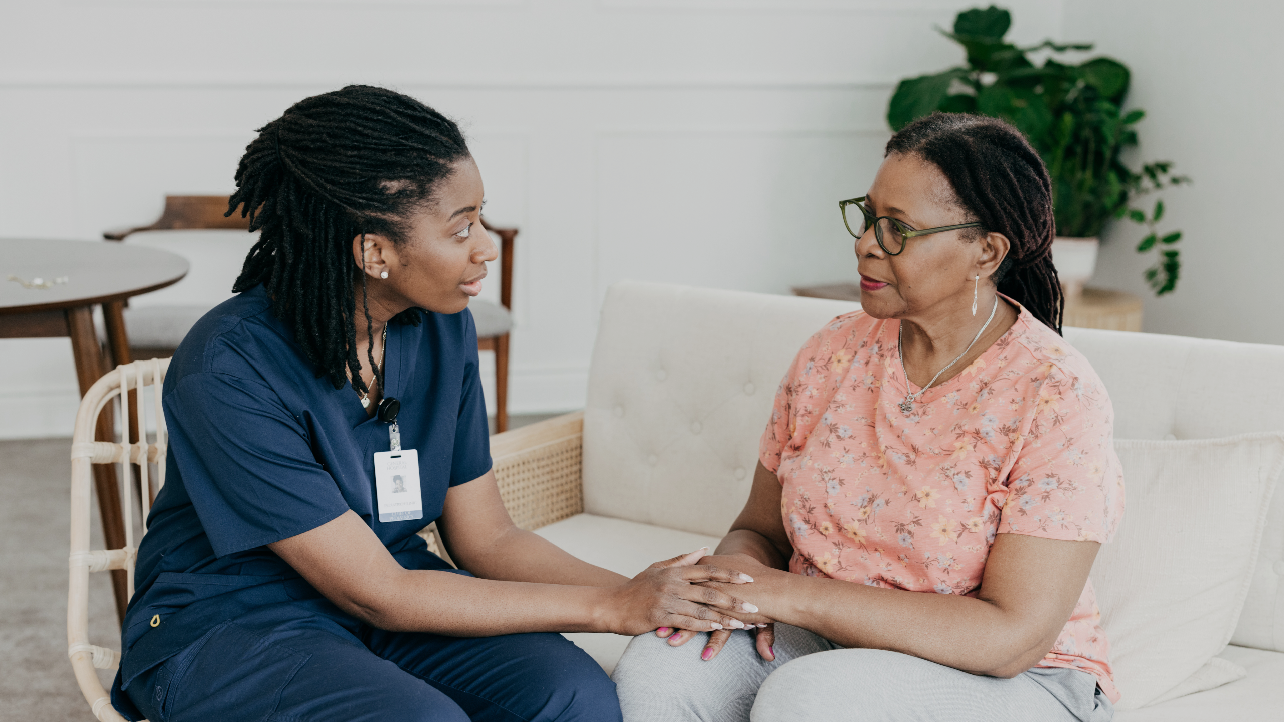 A nurse is pictured comforting her patient