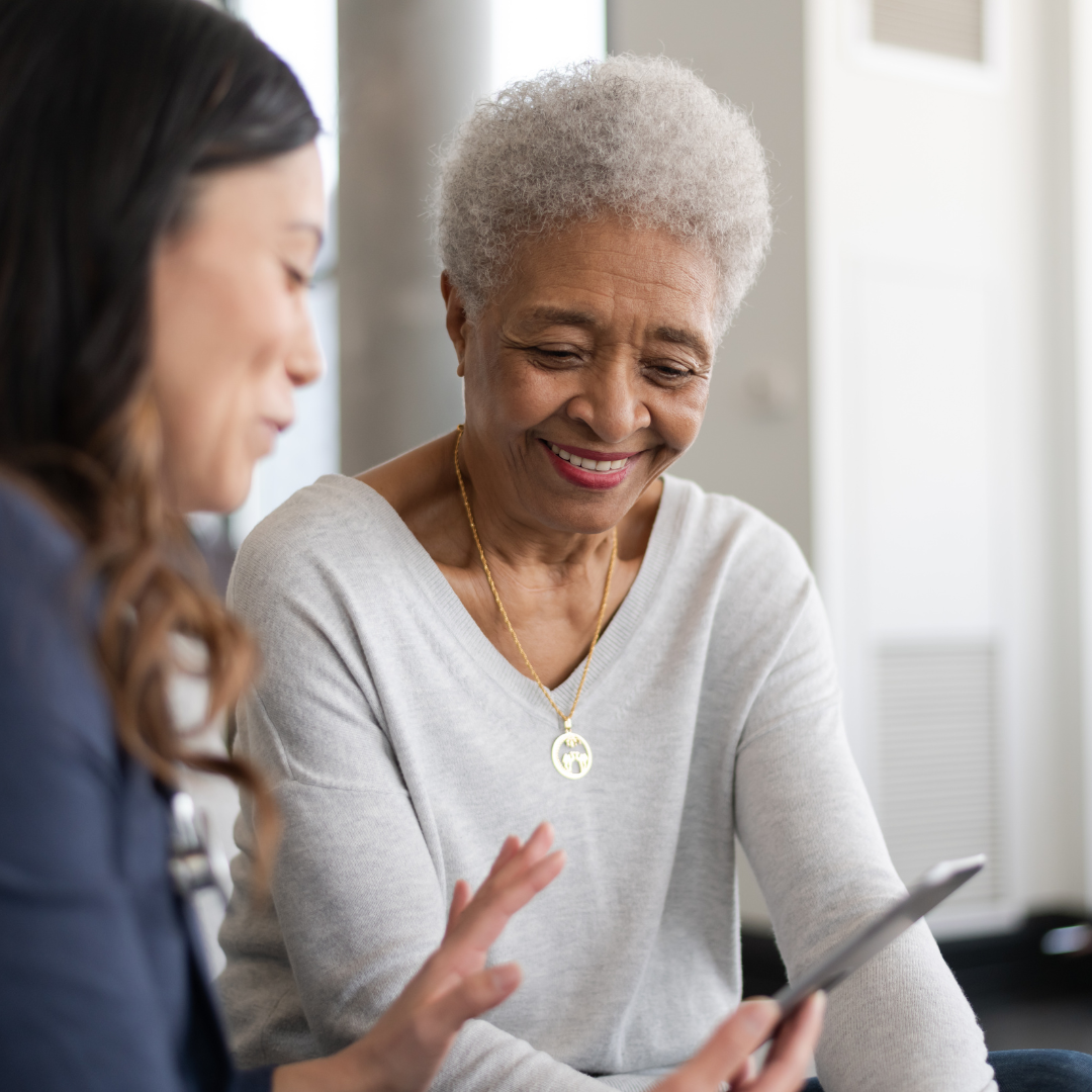 A doctor is shown explaining health test or data results to their patient